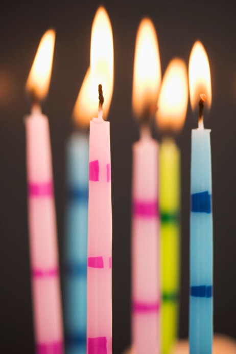 Six Lit Birthday Candles
